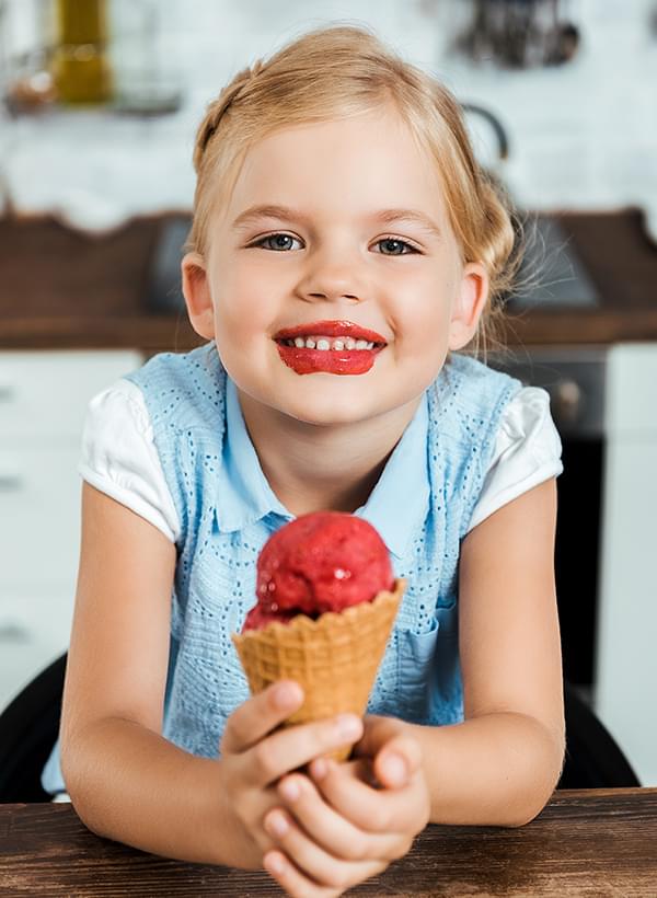 Smiling child with ice cream cone